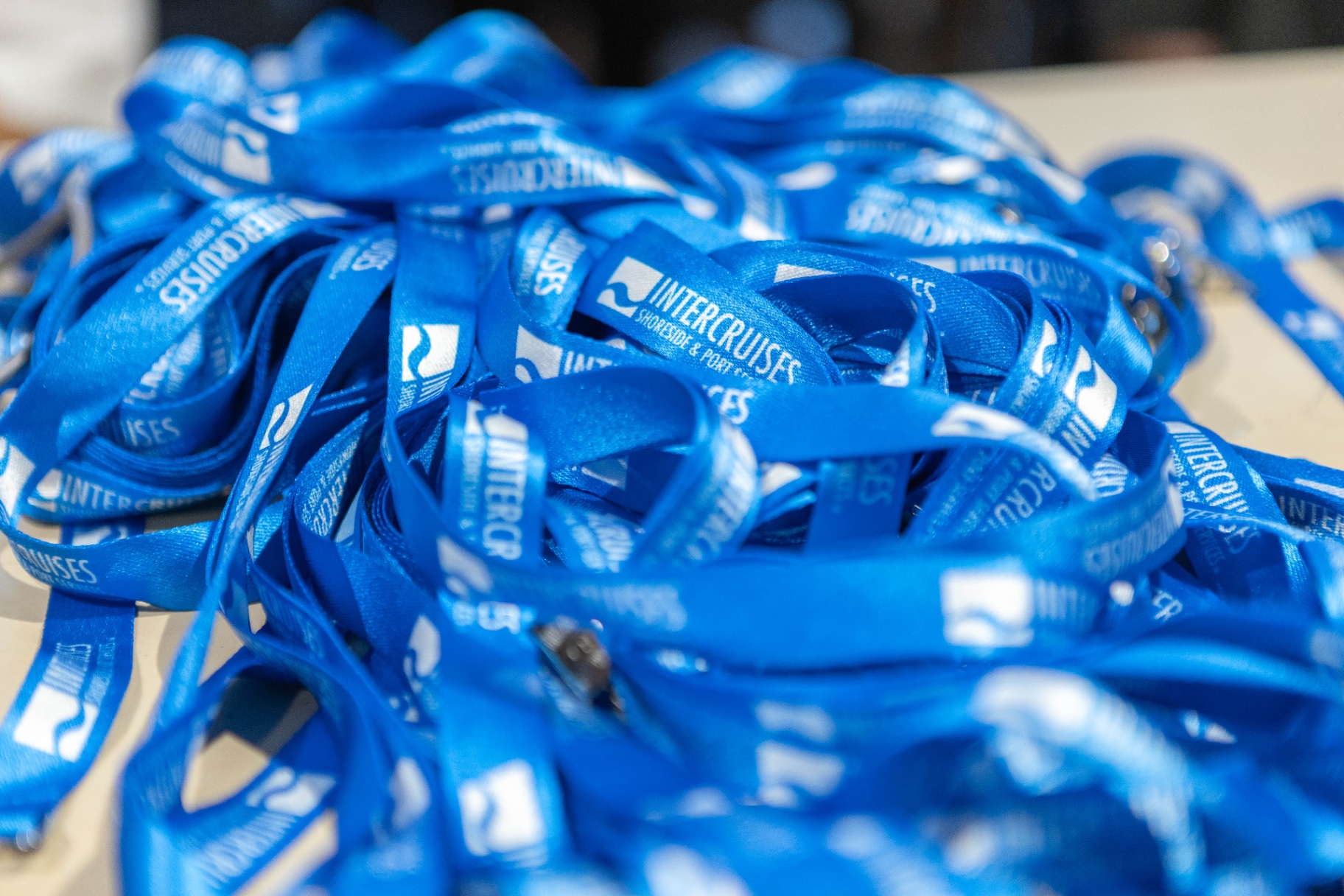 Stack of branded event lanyards